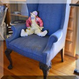 F54. Wing chair with blue upholstery.